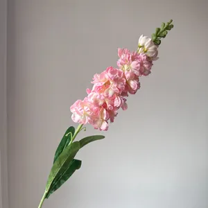 Detailed view of a realistic pink artificial snapdragon flower for French wedding decor