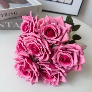 Macro view of 7-head pink artificial rose bouquet with realistic silk petals