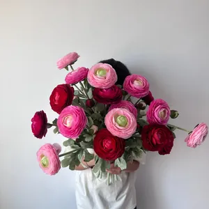 Detailed view of large artificial Ranunculus bouquet with vibrant pink and red flowers