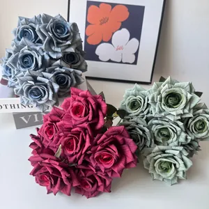 Detailed view of 7-head artificial rose bouquets in dusty pink, blue, and green tones.