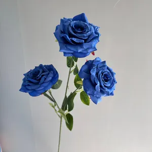 Close-up of 3-head artificial blue roses with realistic water droplets for wedding decor