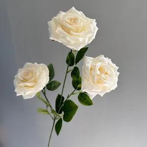 Detailed macro view of white artificial rose with realistic water drops on petals.