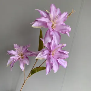 Detailed view of fresh pink artificial lily flower branch for French garden style wedding decoration