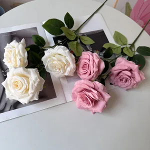 Close-up of 3-head artificial rose bouquet with realistic water droplets for weddings