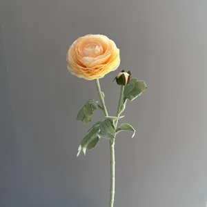 Close-up detail of a 2-head flocked artificial ranunculus flower for home decoration