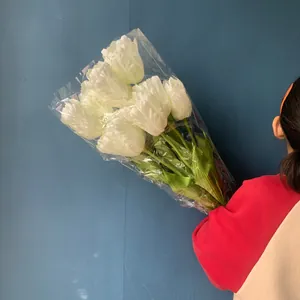 Bouquet of white artificial parrot tulips for home decoration and wedding party events.