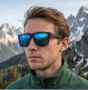 Close-up of men's square polarized sunglasses with blue mirrored lenses in a mountain setting