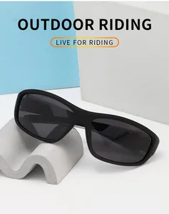 Detailed view of men's polarized sports cycling sunglasses on minimalist props