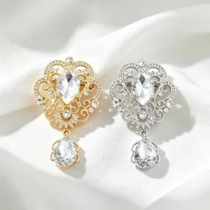 Elegant vintage crown brooches with dangling pear-cut crystals for formal evening wear