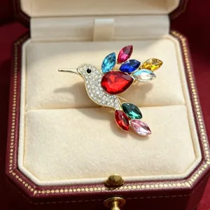 Vibrant rhinestone hummingbird brooch for women, elegant colorful bird fashion jewelry piece