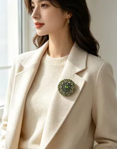 Elegant vintage green rhinestone wreath brooch pinned on a beige luxury blazer lapel