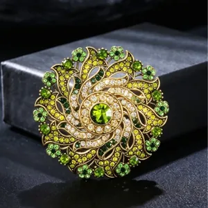 Vintage gold floral wreath brooch with sparkling green and yellow crystals for women