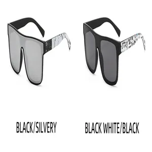 Occhiali da sole oversize flat top nelle varianti colore nero argento e nero bianco