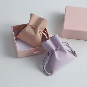 Close-up detail showing the soft microfiber texture of these drawstring jewelry pouches