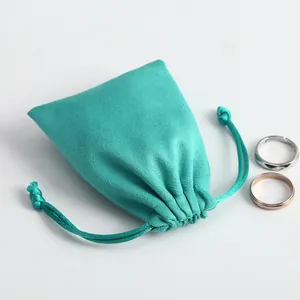 Elegante bolsa de ante turquesa con cordón para guardar anillos y pequeños accesorios