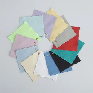 Macro view of colorful microfiber cleaning cloths arranged in a neat circular pattern.