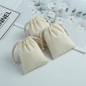 Lot de trois pochettes en coton et lin beige à cordon pour bijoux et cadeaux
