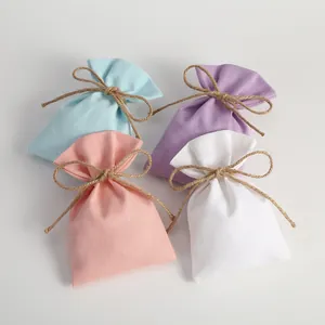 Small cotton canvas drawstring pouches in pastel colors for jewelry gift packaging