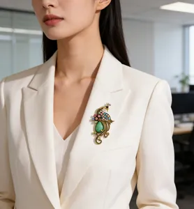 Elegant vintage peacock brooch with colorful rhinestones shown on white blazer