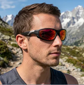 Detailed side view of sporty sunglasses with red mirrored lenses worn by a male model