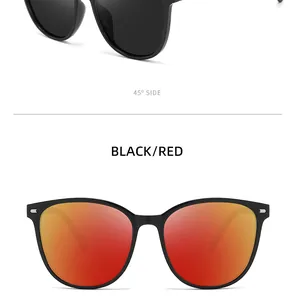 Detailed view of polarized sunglasses showing black frame and red mirrored lenses