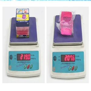 Weight measurement of a pink maltose ice cube stress relief squeeze toy on a digital scale