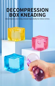 Macro view of colorful translucent square stress relief squishy ice cube toy