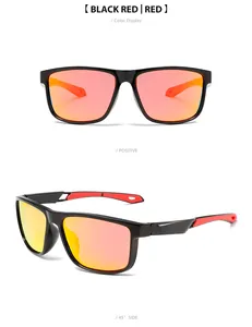 Detail view of black and red polarized sports sunglasses with orange lenses.