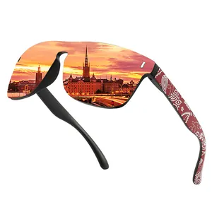 Detailed view of large frame cycling sunglasses with sunset city lens reflection