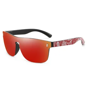 Oversized polarized cycling sunglasses with red mirrored shield lens and paisley pattern temples
