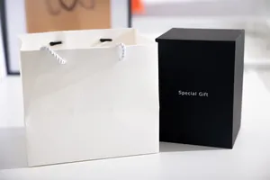 Elegant black gift box and white embossed paper bag for creative night light gift
