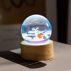 Detailed view of crystal ball night light with resin deer inside for room decoration