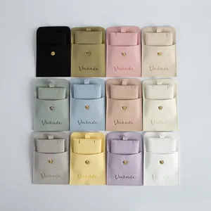 Set of 12 colorful microfiber jewelry pouches with snap buttons for rings and necklaces