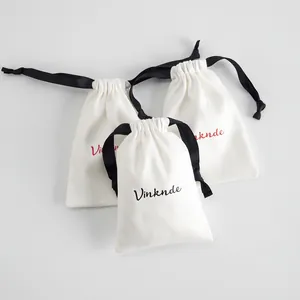 Bolsa de terciopelo blanco para joyas con cordón de cinta negra y logotipo personalizado