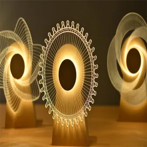Primer plano de luces nocturnas LED 3D con diseños láser de noria y formas espirales