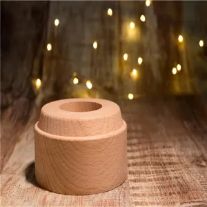 Detailed macro shot of a round tiered wooden base for music boxes or night lights