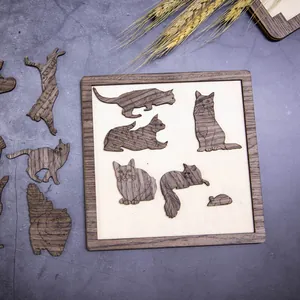 Puzzle en bois artistique sur le thème des chats avec des pièces uniques en bois foncé