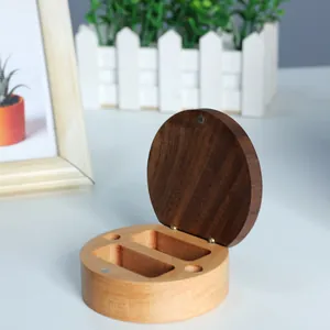 Open view of wooden baby keepsake box for hair and umbilical cord storage.