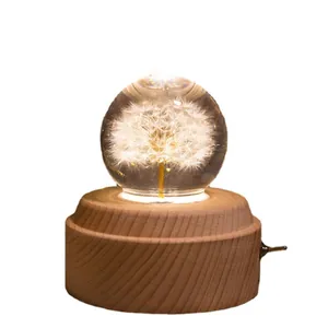 Carillon con sfera di cristallo di dente di leone e base in legno massiccio con LED