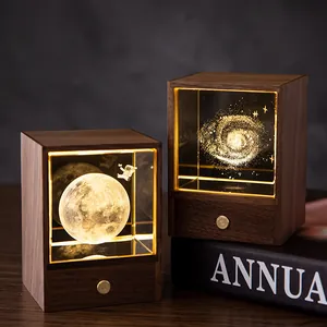 Vintage black walnut night light with luminous crystal astronaut and galaxy cubes.