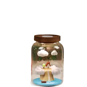 Healing glass bottle night light with a miniature house and floating clouds ornament