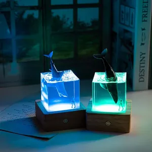 Ocean whale resin night light with miniature diver and glowing LED wooden base decor