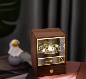 Detail view of solar system laser engraving inside a walnut wooden crystal night light