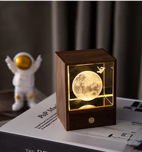 Macro detail of wooden astronaut moon night light with warm LED glow