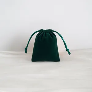 Bolsa de terciopelo verde oscuro con cordón para joyas y empaque de regalo