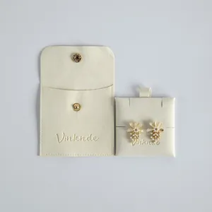 Premium beige velvet jewelry storage pouch with snap flap and elegant branded insert