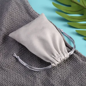 Close-up of a soft gray velvet drawstring pouch for jewelry or accessory storage