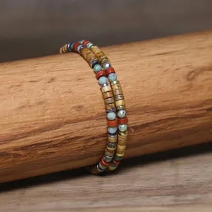 Close-up detail of 2x4mm natural stone beads on a double-layer handmade woven bracelet