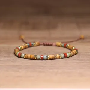 Close-up view of handmade adjustable bracelet with 2x4mm natural Picture Jasper and Red Jasper