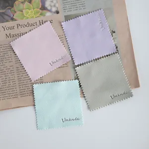 Detailed view of four colorful microfiber cleaning cloths for glasses, jewelry and watches